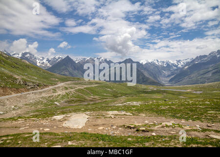 Looking north from Rohtang Pass in Pir Pinjal range of Himalayas, north of Manali on the road to Leh.  High peaks have snow and glaciers Stock Photo