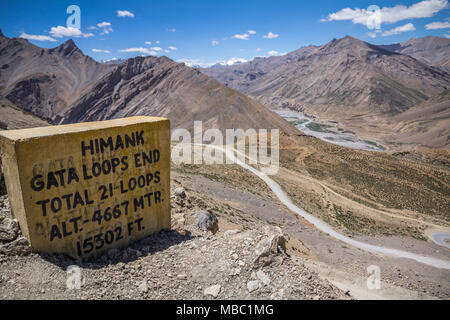 Sign at viewpoint over the Gata Loops on the Manali to Leh road across the Himalayas; the river valley below; and arid mountain tops of Ladakh, India Stock Photo