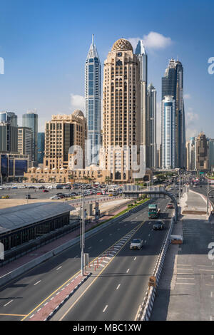 The Metro Tram and tall buildings in the Marina of Dubai, UAE, Middle East. Stock Photo