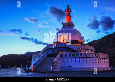 Shanti stupa illuminated in the evening twilight. Leh, Ladakh Stock Photo