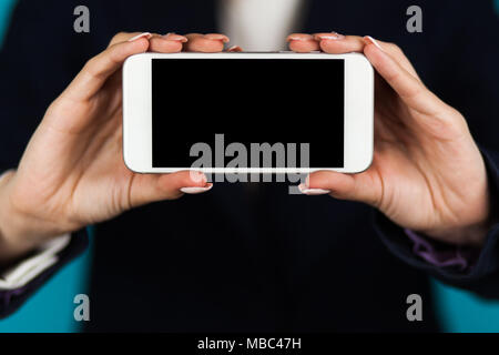 Female hand holding a phone Stock Photo