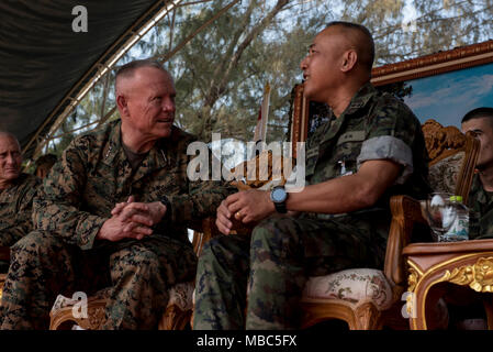 U.S. Marine Corps Lt. Gen. Lawrence Nicholson, left, commanding general, III Marine Expeditionary Force, talks to Royal Thai Marine Corps Rear Admiral Narong Sithinand, commander of Royal Thai Marine Training Center, before a training demonstration Feb. 14, 2018, at the Royal Thai Marine Command in Chonburi province, Thailand. Nicholson visited the Royal Thai Marine Command where he visited with the Royal Thai Marine Corps leadership and watched training demonstrations by Royal Thai Marine Corps recruits during exercise Cobra Gold 2018. The visit was conducted to increase teamwork, strengthen  Stock Photo