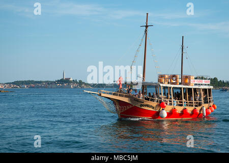 Excursion boat, in the back town Rovinj, Istria, Croatia Stock Photo