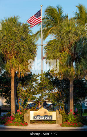 Sign and flag at entrance to Naples Pier, Naples, Florida, USA Stock Photo