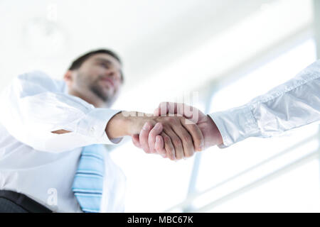 businessman shaking hands to seal a deal with his partner Stock Photo