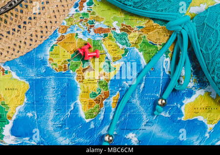 Travel Destination Points on World Map Indicated with Colorful Thumbtacks, Red Ribbon and Shallow Depth of Field. Stock Photo