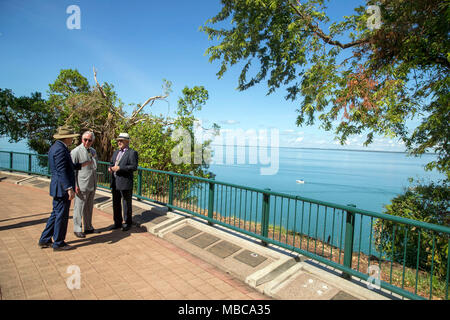 The Prince of Wales is shown memorial plaques at the Cenotaph in Darwin, Australia, by RSL President Bob Shewring, Right, and Michael Gunner, Chief Minister of the Northern Territory, Left. The memorial overlooks Darwin Harbour from which all men left during the First World War and would have been one of the last familiar sites the men would have seen as they sailed off to war and where so many died during the Japanese air attack on 19 February 1942. Stock Photo