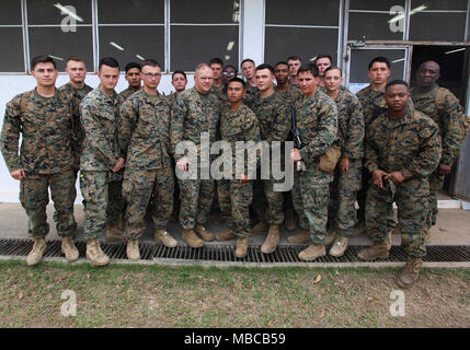 Commandant of the Marine Corps Gen. Robert B. Neller and Sergeant Major of the Marine Corps Sgt. Maj. Ronald L. Green pose for a photo with Marines during a visit to Ban Chan Khrem, Thailand, Feb. 18, 2018. Neller addressed the Marines about his latest Message to the Force: Execute and answered questions. (U.S. Marine Corps Stock Photo