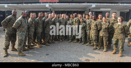 Commandant of the Marine Corps Gen. Robert B. Neller and Sergeant Major of the Marine Corps Sgt. Maj. Ronald L. Green pose for a photo with Marines during a visit to U-Tapao, Thailand, Feb. 18, 2018. Neller addressed the Marines about his latest Message to the Force: Execute and answered questions. (U.S. Marine Corps Stock Photo