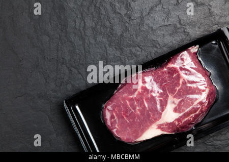 Raw steak in an airtight packaging Stock Photo