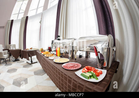 Buffet heated trays ready for service. Breakfast in hotel smorgasbord. Stock Photo
