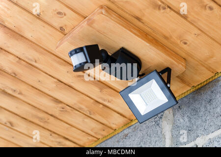 Led outdoor lantern with motion sensor.  Water resistant diod street lamp. Electricity savings. Stock Photo