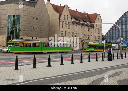 Trams travel through the city of Poznan, Poland. Stock Photo