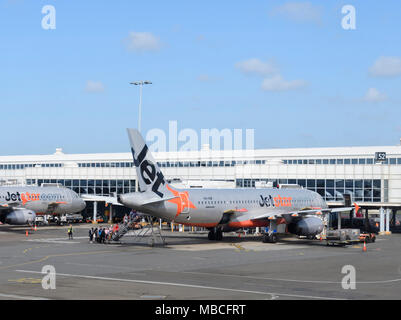 Passengers boarding a Jetstar Airbus A320 aircraft from the rear at Sydney airport, domestic terminal, Australia Stock Photo