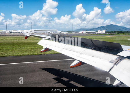 Plane landing and breaking with the flap up, Sydney airport, Australia Stock Photo