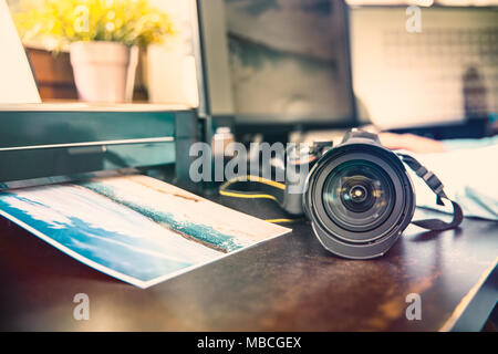 Unknown camera and photo printer on the graphic desk Stock Photo