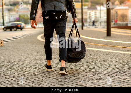 Close up look of the clothes and style of a man on the street in the sunset Stock Photo
