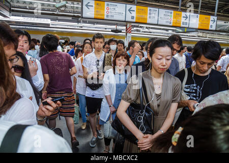 Tokyo Japan,Asia,Orient,Shinjuku,JR Shinjuku Station,Yamanote Line,subway,train,train,train,passenger passengers rider riders,Asian Asians ethnic immi Stock Photo