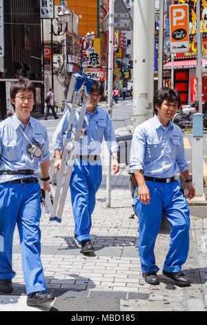 Tokyo Japan,Ikebukuro,Asian Oriental,man men male adult adults,workers,uniform,ladder,maintenance,working,work,employee worker workers staff,Japanese, Stock Photo