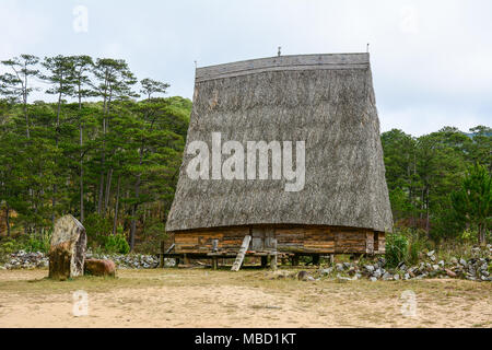 Traditional houses at an ethnic village in Central Highlands of Vietnam. Stock Photo