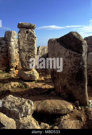 Menorca Archaeology. Menhirs in the ancient remains in the taula enclave at Torre d'en Gaumes. Stock Photo