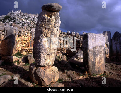 Menorca Archaeology. Menhirs in the ancient remains in the taula enclave at Torre d'en Gaumes. Stock Photo