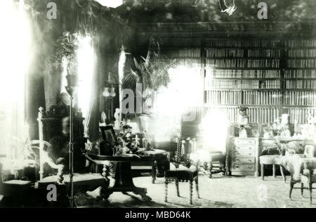 GHOSTS - SPIRIT PHOTOS The Ghost of Lord Combermere. One of the most famous of all spirit photographs, this was taken in the library of Combermere Abbey, in 1891, by Sybell Corbet, an amateur photographer. The library was empty when she took the photograph (she remained there during the long exposure), yet when the plate was developed, the image of an old man, seated in the high-back chair to the left, was quite visible. It turned out that at the time the picture was being taken, Lord Combermere was being buried at Wrenbury, a few miles from the Abbey. It was observed that the ghost had n Stock Photo
