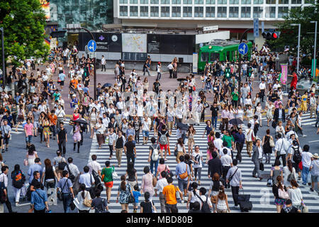 Tokyo Japan,Asia,Orient,Shibuya,JR Shibuya Station,Shibuya Crossing,kanji,characters,symbols,Japanese English,crowd,visitors travel traveling tour tou Stock Photo
