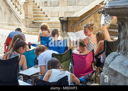 Architecture students drawing architectural details during en plein air assignment near Basilica of Santa Maria Maggiore in historical Upper Town Stock Photo