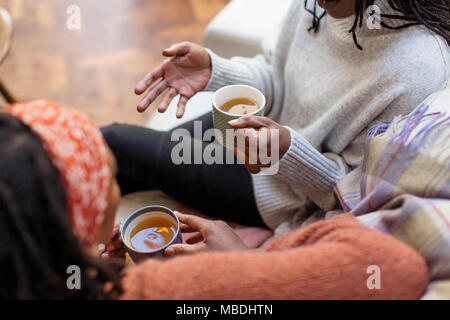 Women friends talking and drinking tea Stock Photo