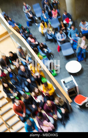 Defocused overhead view of conference audience Stock Photo