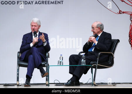 Former US President Bill Clinton and Senator George Mitchell at an event to mark the 20th anniversary of the Good Friday Agreement, at Queen's University in Belfast. Stock Photo