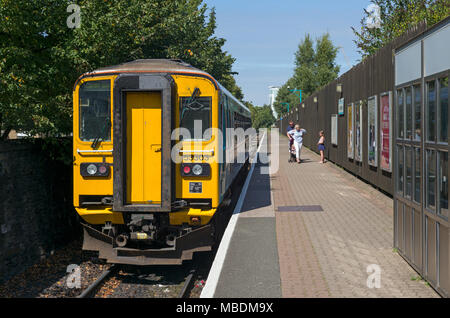 A single car diesel train departing Cardiff Bay station on an Arriva Trains Wales service to Cardiff Queen Street Stock Photo