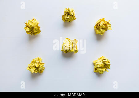 Yellow paper balls on white background. Idea Concept Stock Photo