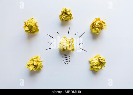 Creative idea. Concept of idea and innovation with yellow paper ball and light bulb Stock Photo