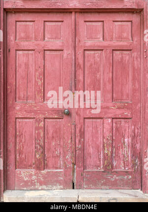 Old, Weathered, Red Painted Door for Background. Stock Photo