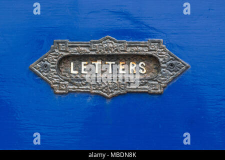 Close-up of traditional old letterbox plate.  Possible metaphor for mail drop concept, junk mail, direct mail marketing, e-mail etc. Stock Photo