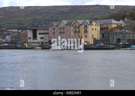 bantry harbour, west cork, ireland, with multicoloured apartments and shops on the seafront, a popular tourist and holiday makers destination Stock Photo