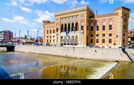 Historic Sarajevo City Hall on Miljacka River in the old city center Stock Photo