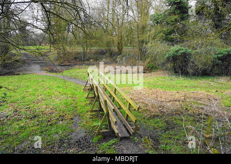 Bridge across a small stream in Springtime. Taken in Derbyshire, England, United Kingdom Stock Photo