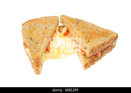 Toasted emmental cheese, ham and tomato sandwich isolated against white Stock Photo