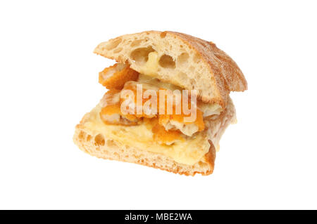 Fish fingers with melted Emmental cheese in ciabatta bread isolated against white Stock Photo