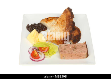 Farmhouse pate with toast, salad and red onion marmalade on a plate isolated against white Stock Photo