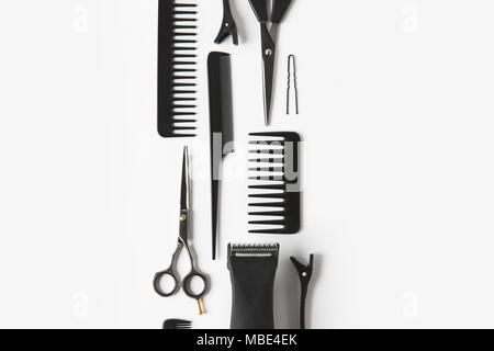 flat lay with hair clipper and hairdressing tools, on white Stock Photo