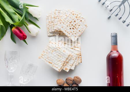 top view of matza and wine with flowers, jewish Passover holiday concept Stock Photo