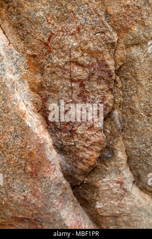 Ancient rock art at Matobo National Park in Zimbabwe. The painting depicts an animal. Stock Photo