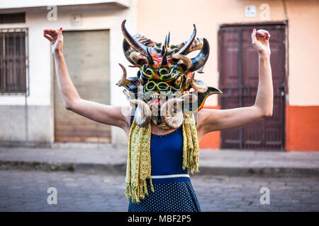 Píllaro, ECUADOR - FEBRUARY 6, 2016: Unidentified woman, dressed as Devil in the diabladas festivities in Pillaro. Stock Photo