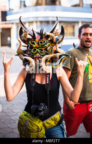 Píllaro, ECUADOR - FEBRUARY 6, 2016: Unidentified woman, dressed as Devil in the diabladas festivities in Pillaro, January 6, 2016. Stock Photo