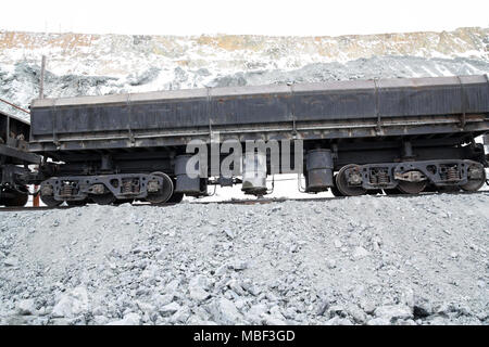 The car loaded with ore stands on the way in the quarry. Stock Photo