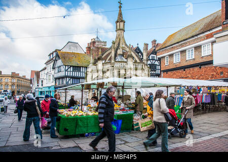 A market next to the Poultry Cross or Old Market Cross in Salisbury, Wiltshire. Stock Photo